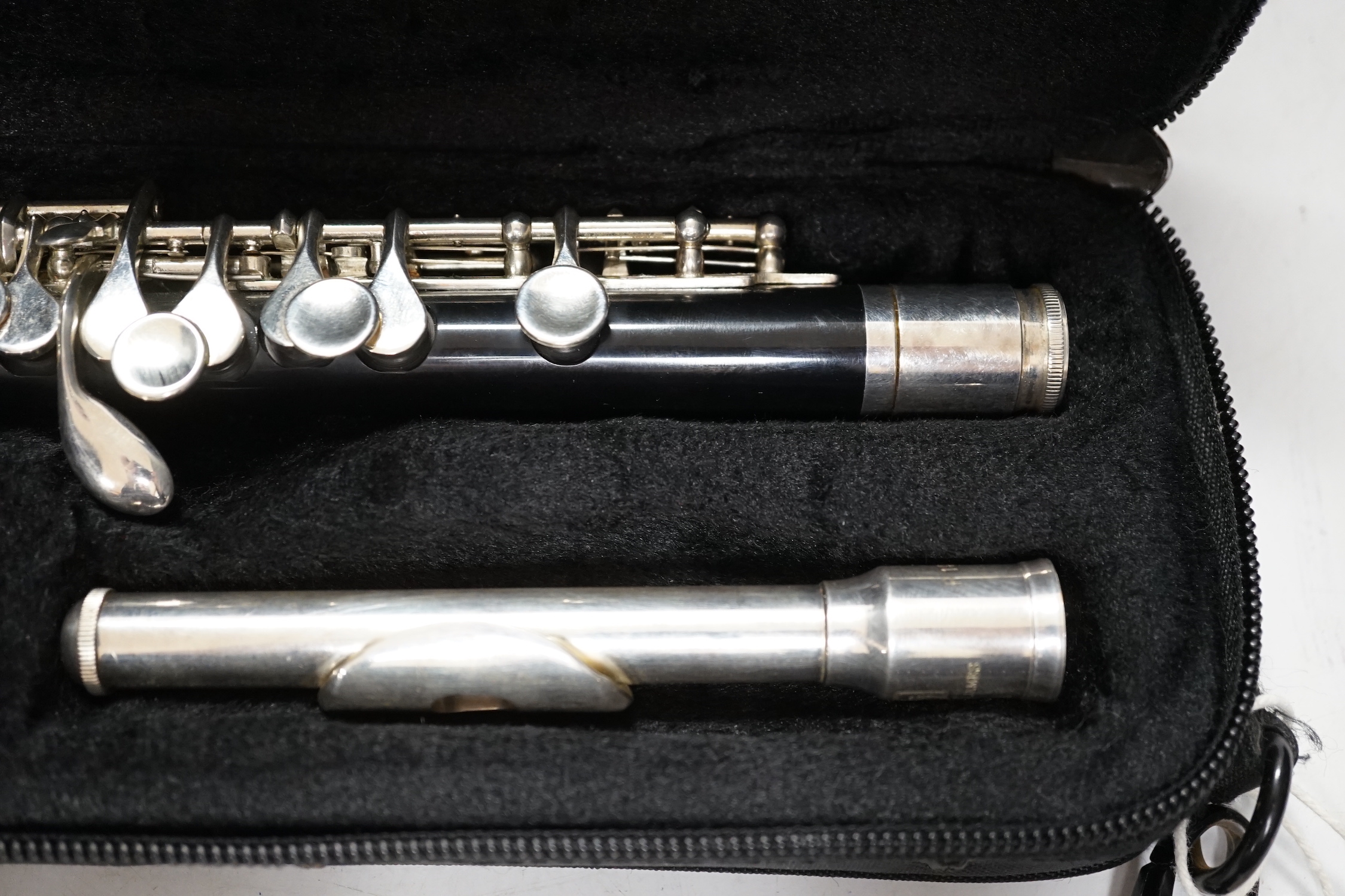 A cased Trevor James student’s piccolo, P1